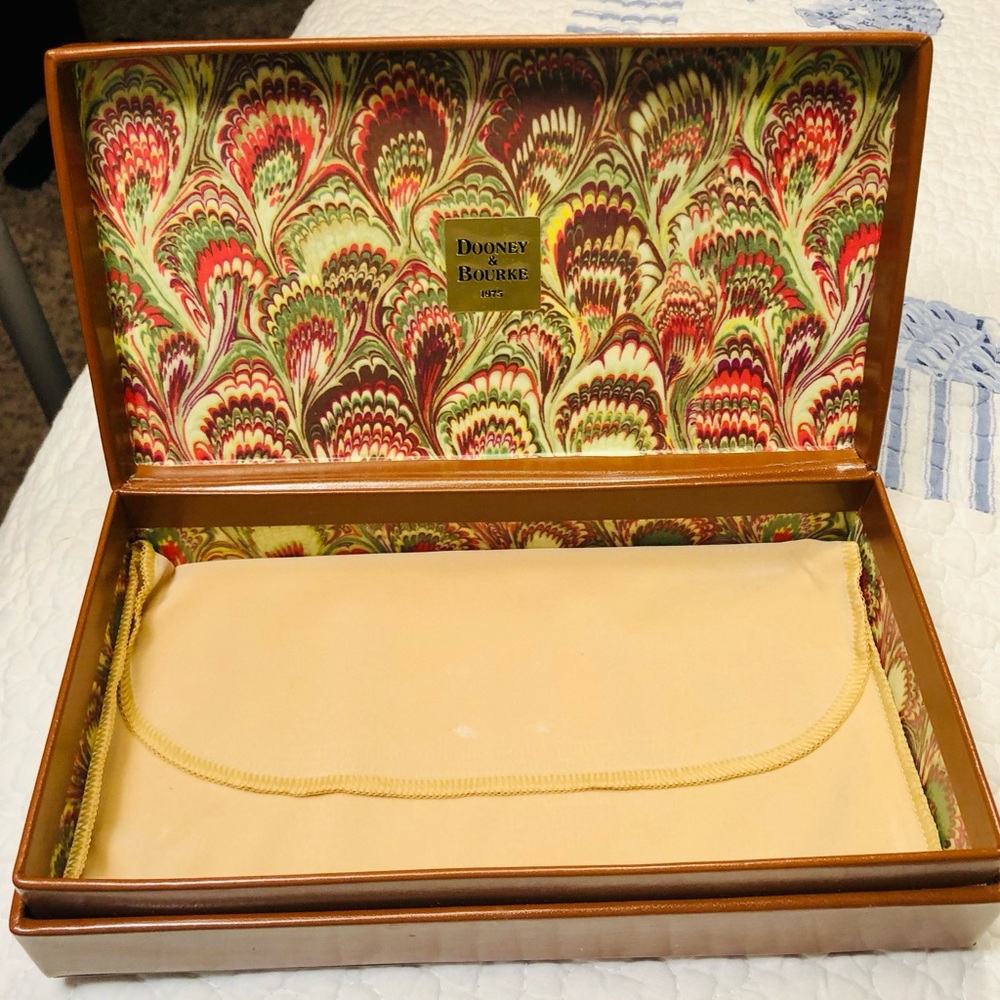 Vintage Dooney & Bourke leather wallet box with protective wallet cover.